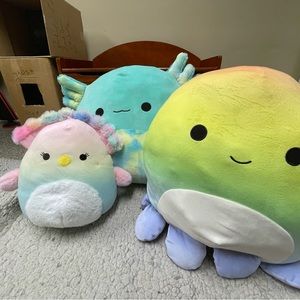 three squishmallows in one pack, includes a Axolotl peacock and a octopus
